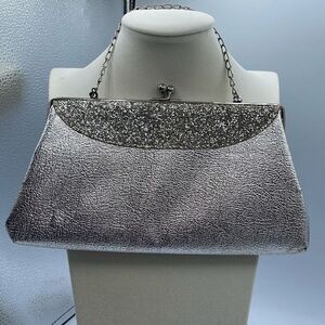 Vintage mid century silver foil clutch with silver cut stones .